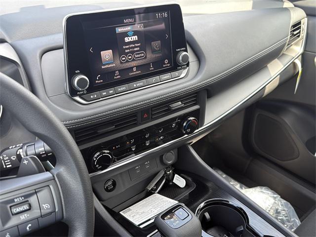 Photo of 2026 Scarlet Ember Tintcoat Nissan Rogue