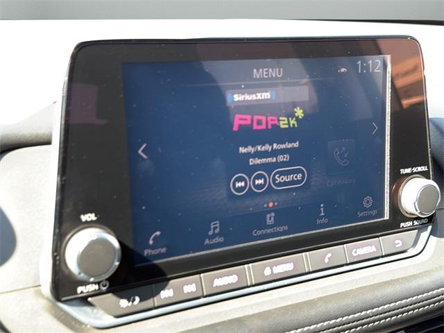 Photo of 2023 Pearl White Tricoat Nissan Rogue