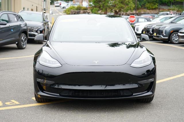 Photo of 2021 Deep Blue Metallic Tesla Model 3