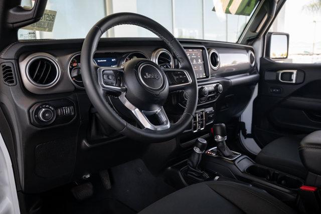 Photo of 2021 Bright White Clearcoat Jeep Wrangler Unlimited