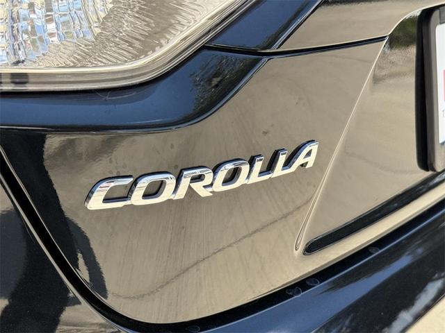 Photo of 2024 Midnight Black Metallic Toyota Corolla