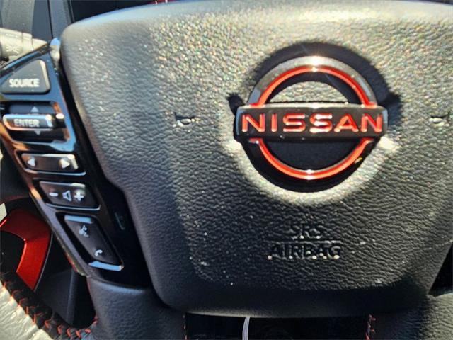 Photo of 2024 Glacier White Nissan Frontier