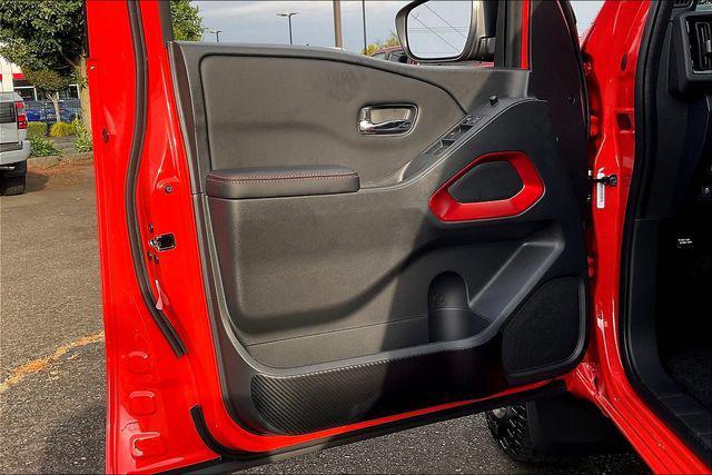 Photo of 2025 Afterburn Orange Nissan Frontier