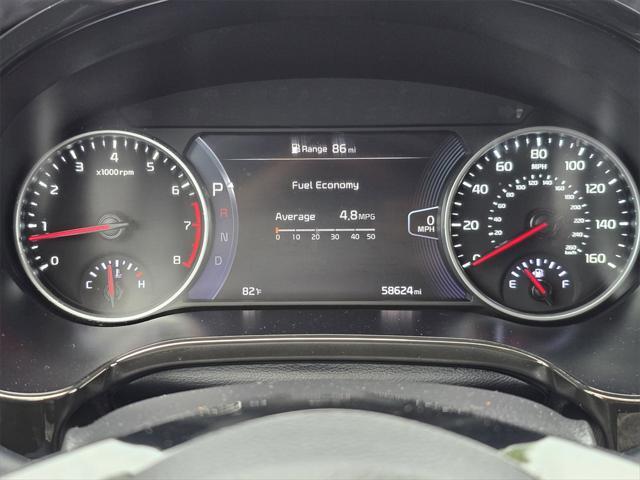 Photo of 2023 Starbright Yellow/Black Roof Kia Seltos