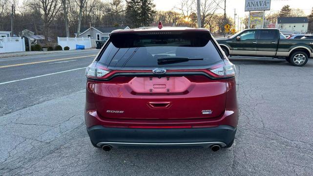 Photo of 2015 Ruby Red Metallic Tinted Clearcoat Ford Edge