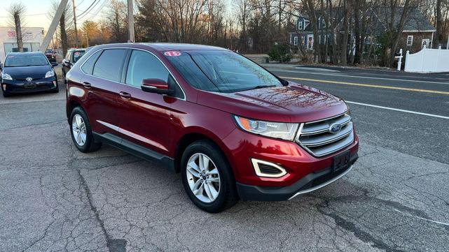 Photo of 2015 Ruby Red Metallic Tinted Clearcoat Ford Edge