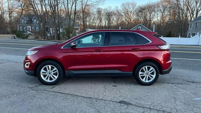 Photo of 2015 Ruby Red Metallic Tinted Clearcoat Ford Edge
