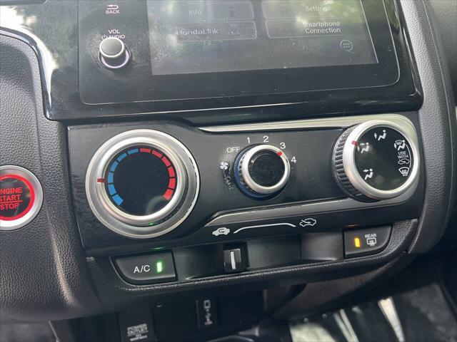 Photo of 2018 Helios Yellow Pearl Honda Fit