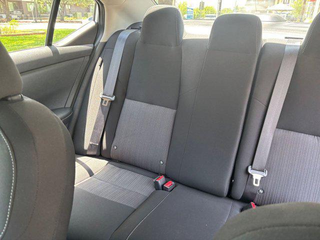 Photo of 2024 Aspen White Tricoat Nissan Sentra
