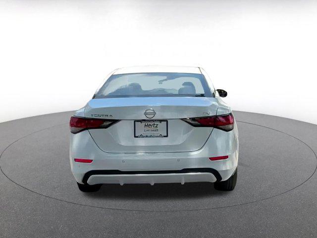 Photo of 2024 Aspen White Tricoat Nissan Sentra