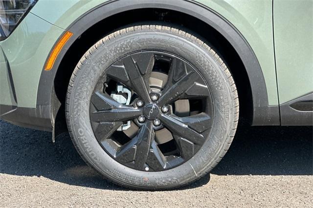 Photo of 2025 Jungle Green Kia Sportage