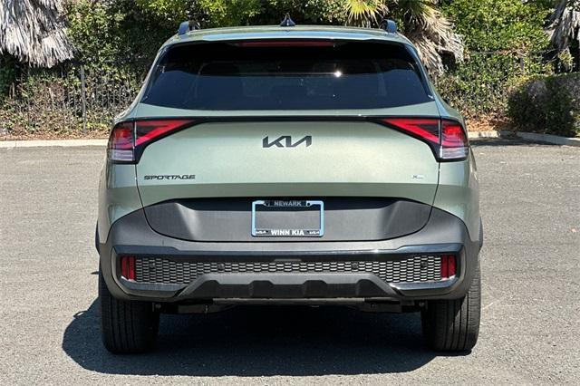 Photo of 2025 Jungle Green Kia Sportage