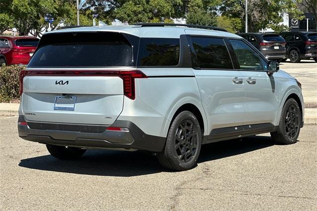 Photo of 2026 Ivory Silver Kia Carnival Hybrid