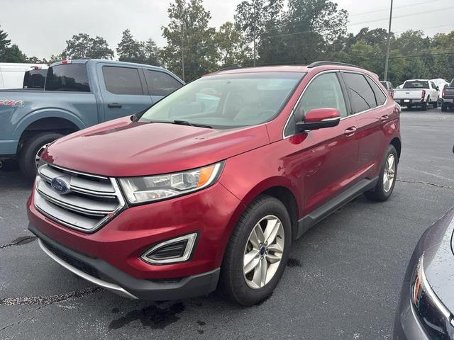 Photo of 2016 Ruby Red Metallic Tinted Clearcoat Ford Edge