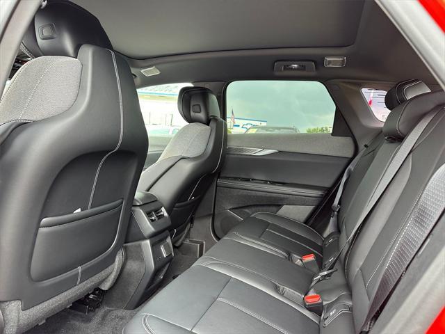Photo of 2025 Monarch Orange Cadillac OPTIQ