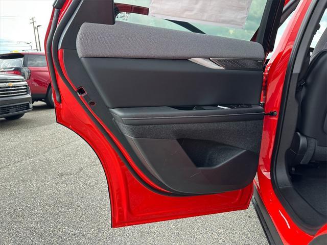 Photo of 2025 Monarch Orange Cadillac OPTIQ