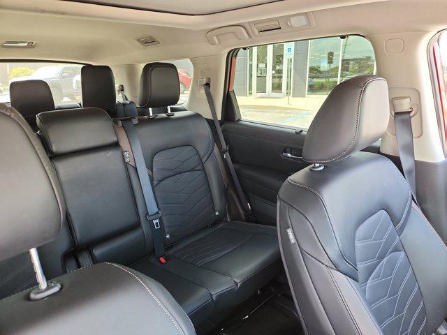 Photo of 2025 Scarlet Ember Tintcoat Nissan Pathfinder