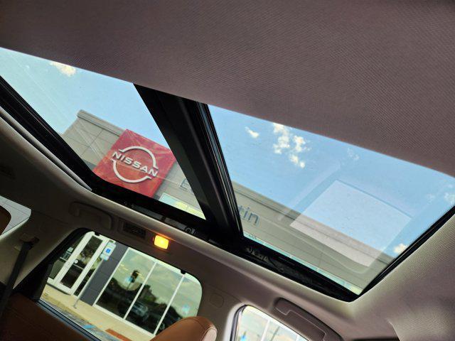 Photo of 2025 Scarlet Ember Tintcoat Nissan Pathfinder