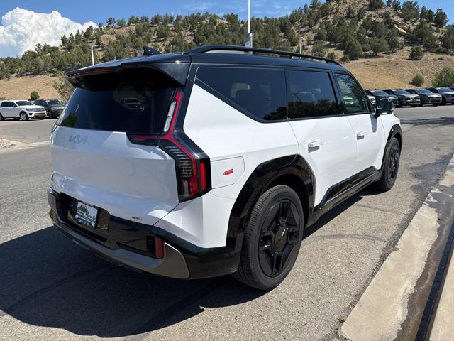 Photo of 2026 Glacier White Pearl/Ebony Black Roof Kia EV9