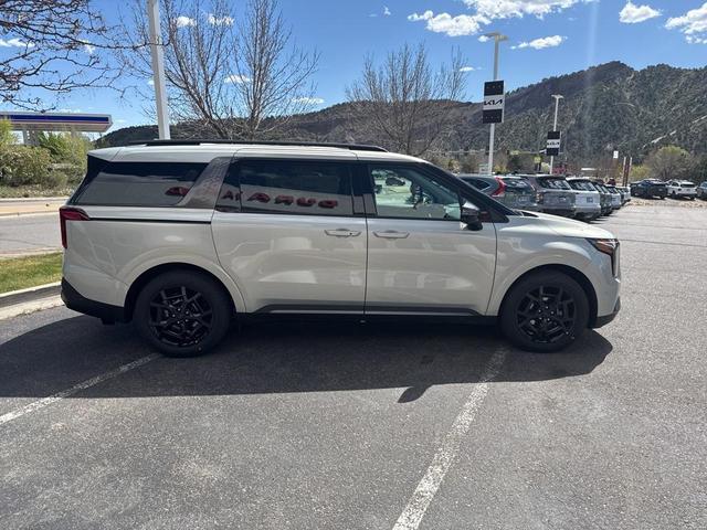 Photo of 2025 Ivory Silver Kia Carnival Hybrid