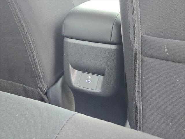Photo of 2025 Aspen White Tricoat Nissan Versa