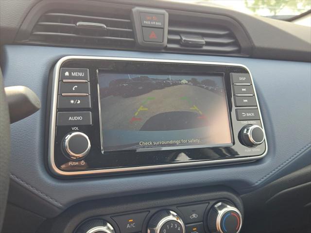 Photo of 2025 Aspen White Tricoat Nissan Versa