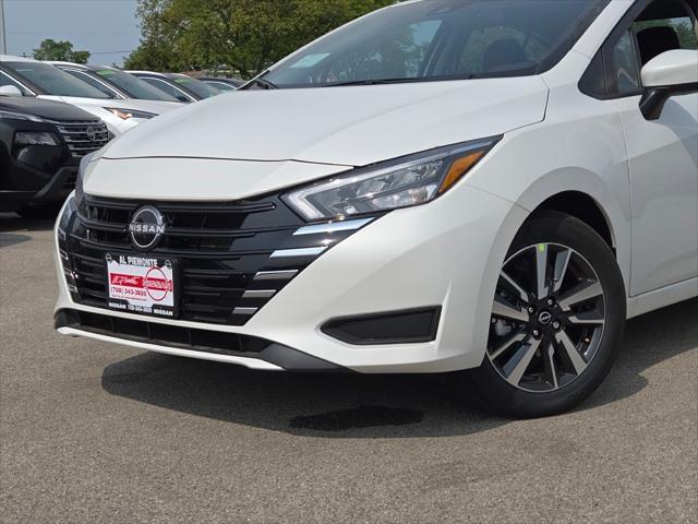 Photo of 2025 Aspen White Tricoat Nissan Versa