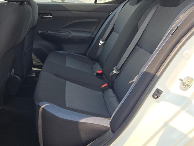 Photo of 2025 Aspen White Tricoat Nissan Versa