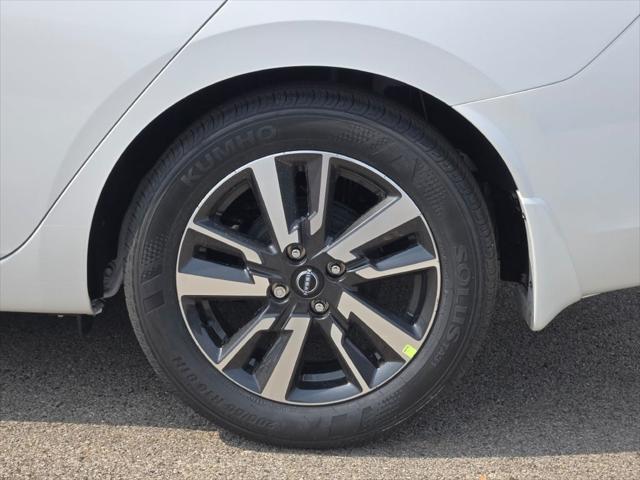 Photo of 2025 Aspen White Tricoat Nissan Versa