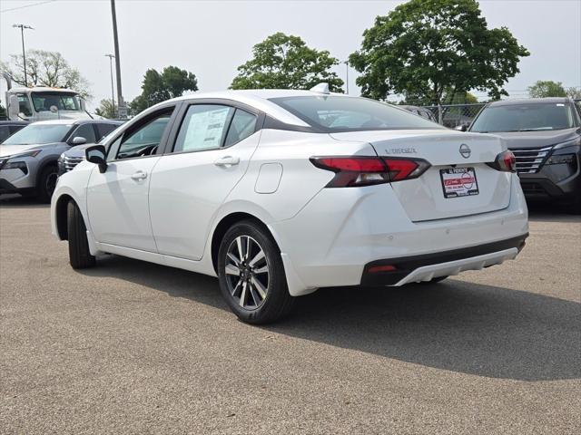 Photo of 2025 Aspen White Tricoat Nissan Versa