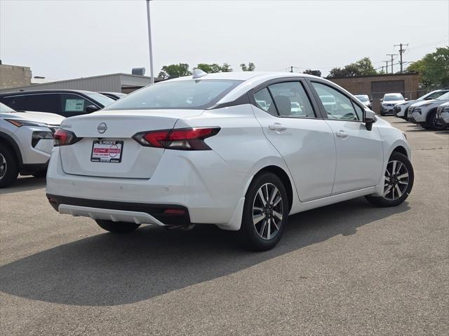 Photo of 2025 Aspen White Tricoat Nissan Versa