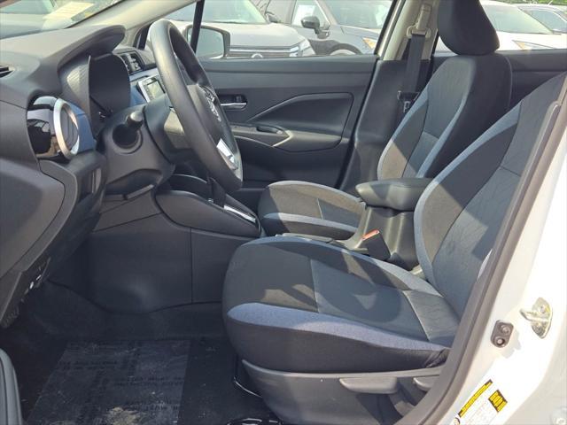 Photo of 2025 Aspen White Tricoat Nissan Versa