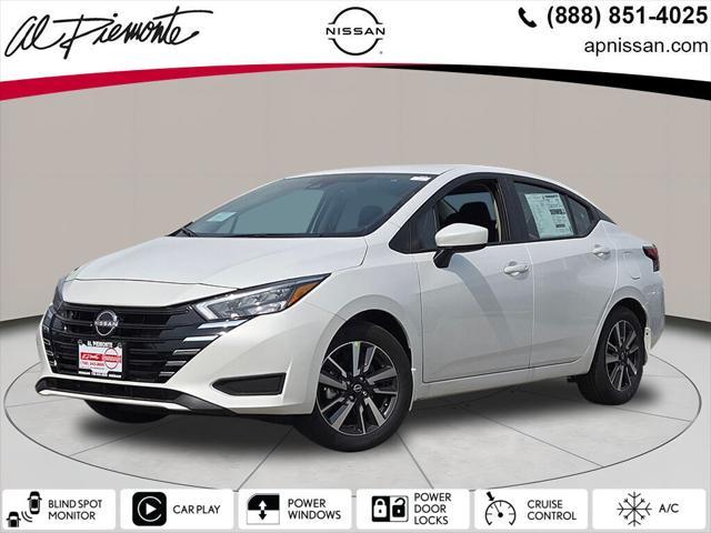 Photo of 2025 Aspen White Tricoat Nissan Versa