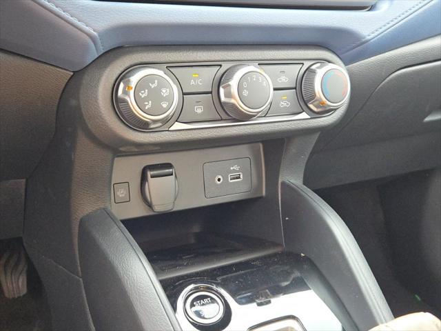 Photo of 2025 Aspen White Tricoat Nissan Versa