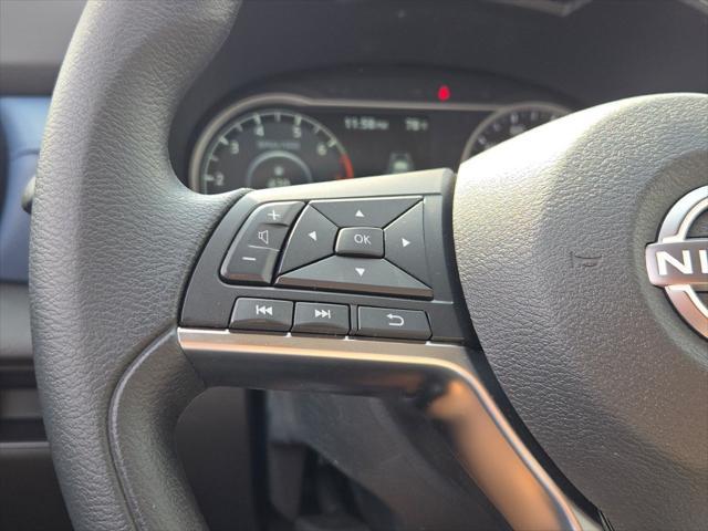 Photo of 2025 Aspen White Tricoat Nissan Versa