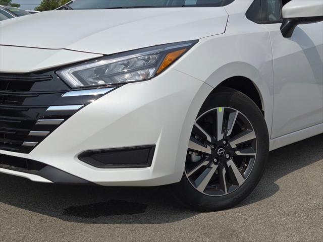 Photo of 2025 Aspen White Tricoat Nissan Versa