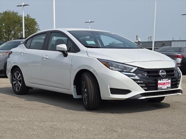 Photo of 2025 Aspen White Tricoat Nissan Versa