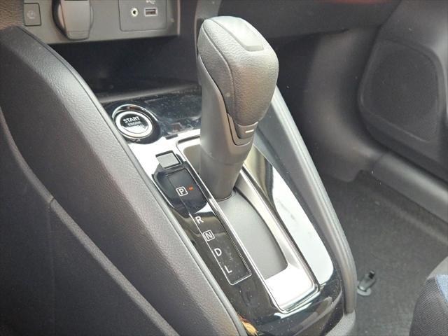 Photo of 2025 Aspen White Tricoat Nissan Versa