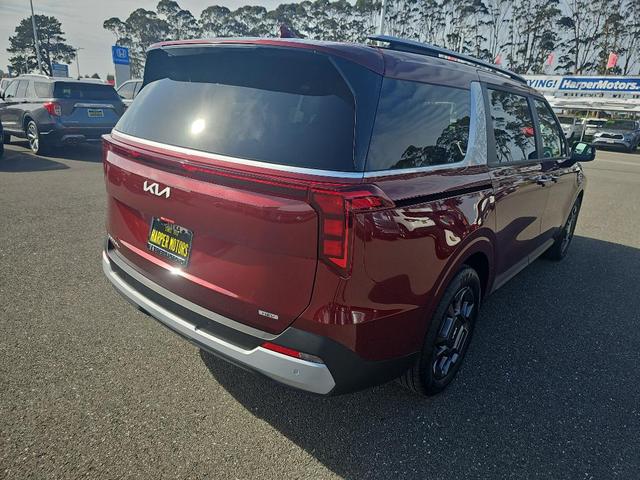 Photo of 2026 Flare Red Kia Carnival Hybrid