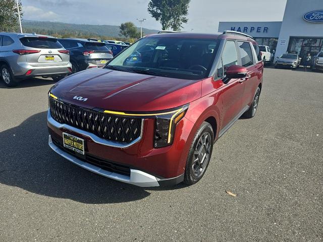 Photo of 2026 Flare Red Kia Carnival Hybrid