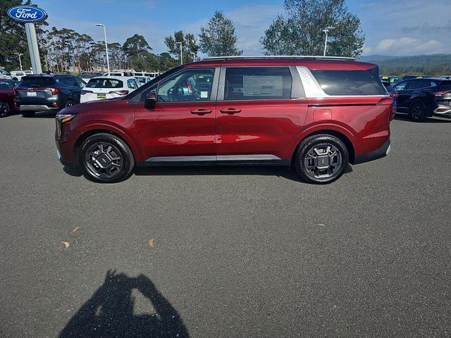 Photo of 2026 Flare Red Kia Carnival Hybrid