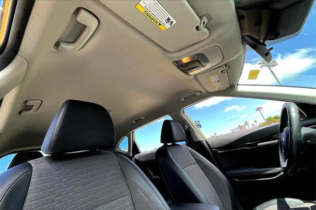 Photo of 2021 Starbright Yellow / Black Roof Kia Seltos