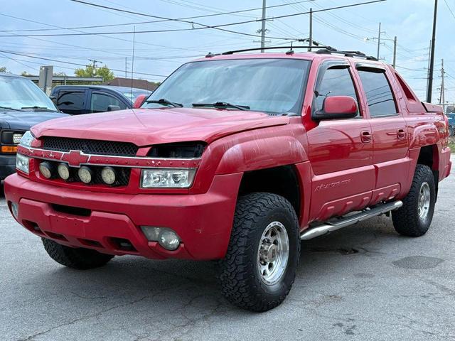 Photo of 2003 Victory Red Chevrolet Avalanche