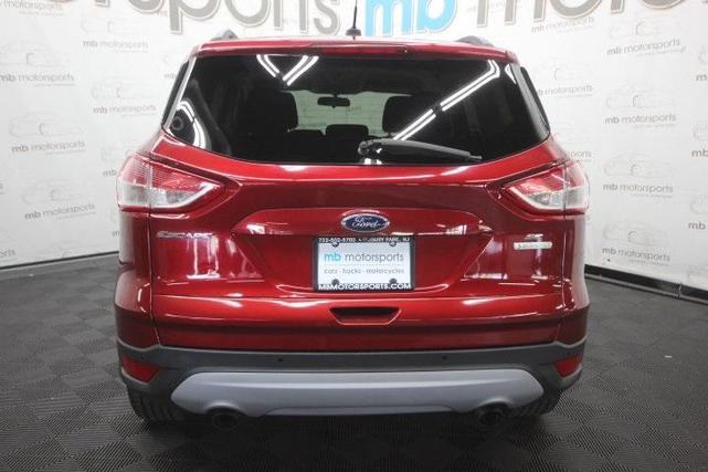 Photo of 2014 Ruby Red Tinted Clearcoat Ford Escape