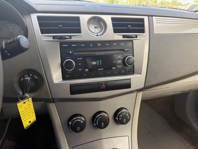 Photo of 2008 Stone White Clearcoat/Black Vinyl Top Chrysler Sebring