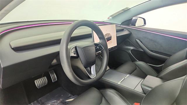 Photo of 2025 Black Tesla Model 3