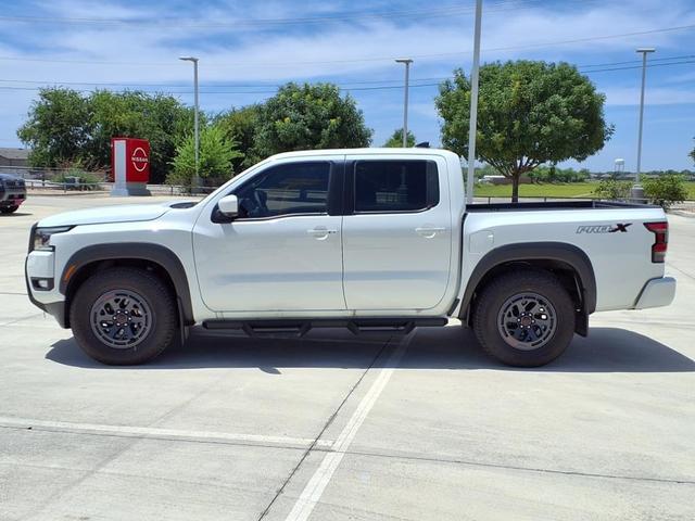 Photo of 2025 Glacier White Nissan Frontier