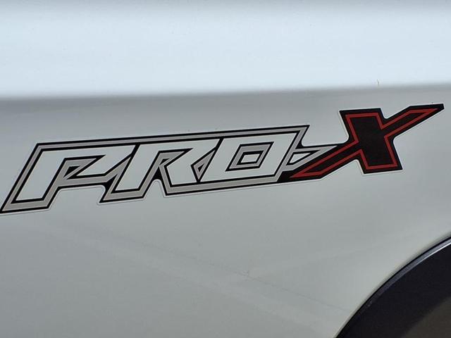 Photo of 2025 Glacier White Nissan Frontier
