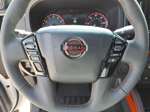 Photo of 2025 Glacier White Nissan Frontier