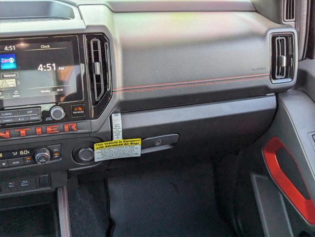 Photo of 2025 Glacier White Nissan Frontier